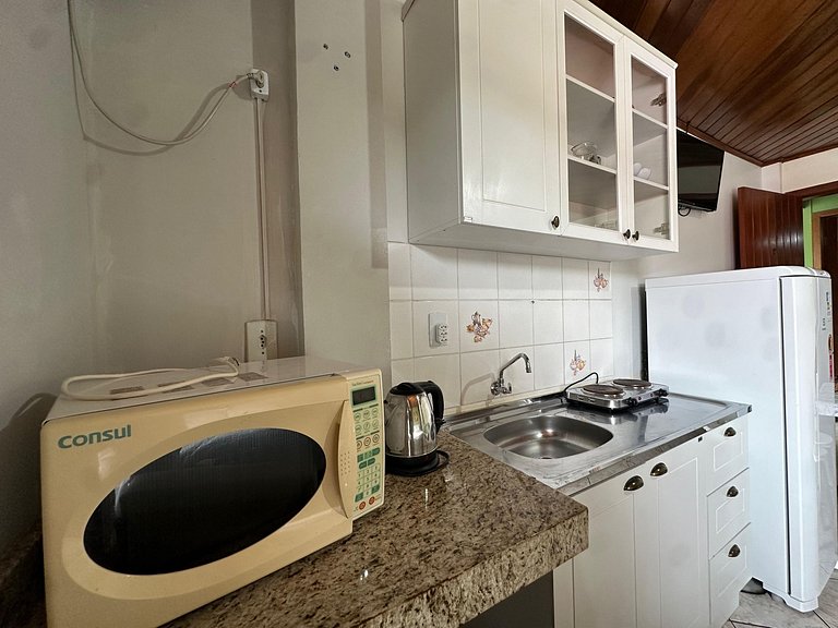 Suíte para até 04 pessoas bem localizada na praia do Centro